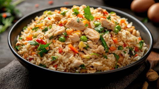 High-Protein Chicken Fried Rice with grilled chicken breast, basmati rice, egg whites, carrots, peas, and bean sprouts in a fresh meal prep container.