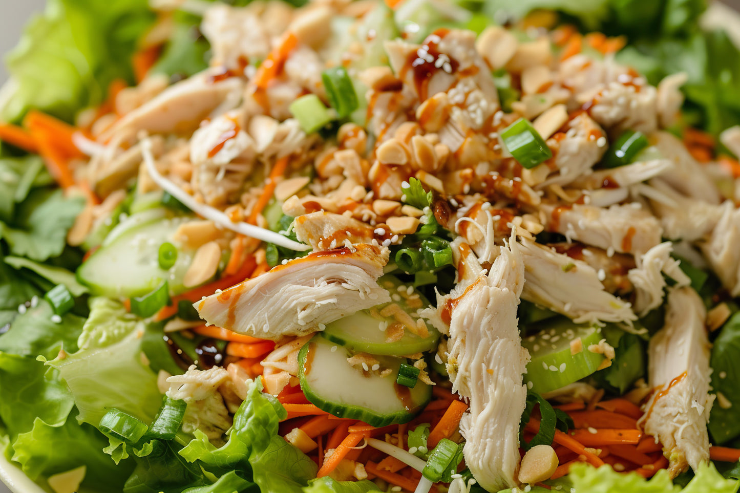 Fresh Mandarin Chicken Crunch Salad with grilled chicken breast, napa cabbage, romaine, mandarin oranges, edamame, toasted almonds, crispy wonton strips, and a house-made sesame dressing.